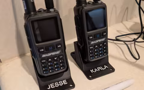 Baofeng UV-5R mini next to a sharpie for size comparison. They are very compact handheld radios.