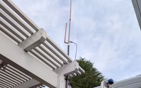 The KB9VBR 2 meter J pole mounted above our backyard Pergola